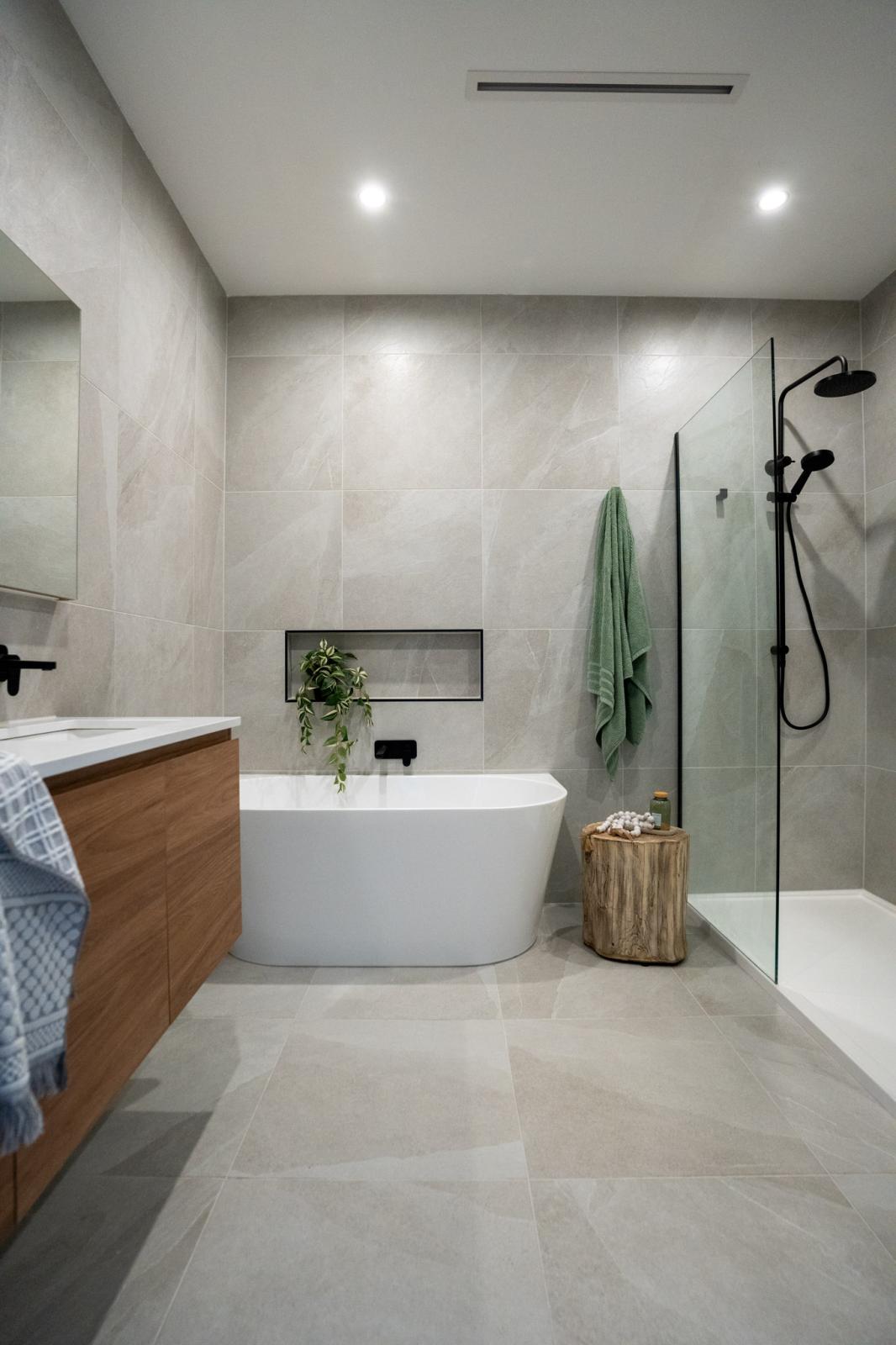 Modern bathroom with freestanding bath, timber vanity and walk-in shower