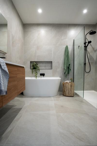 Modern bathroom with freestanding bath, timber vanity and glass walk-in shower
