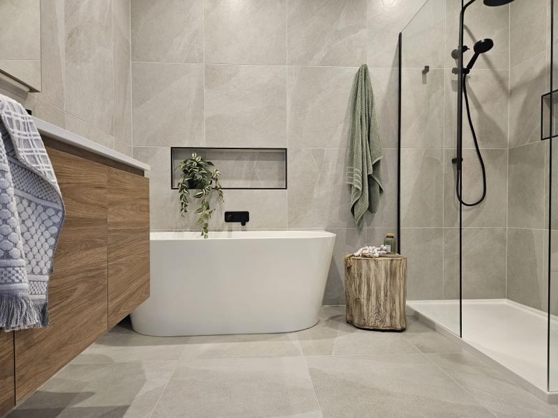 Modern bathroom with freestanding bath, timber vanity and walk-in shower