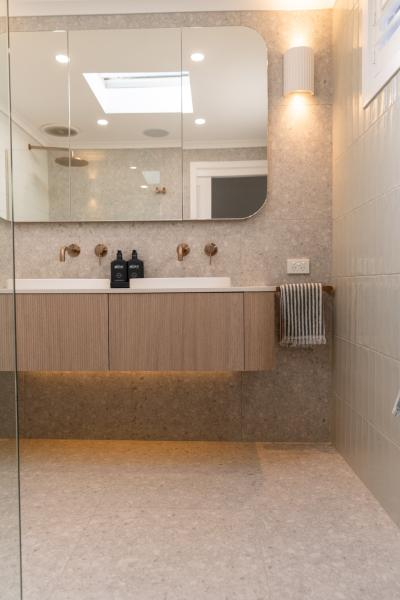 Modern bathroom with floating timber vanity, mirror cabinet and walk-in shower