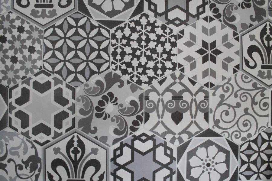 Close-up of patterned grey and white mosaic-style bathroom tiles