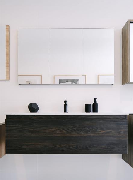 Modern bathroom vanity with mirrored cabinet, black basin mixer and dark timber cabinetry