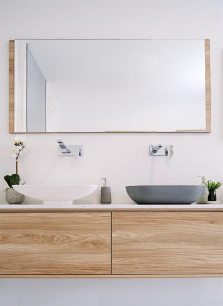 Modern timber vanity with twin basins and large bathroom mirror