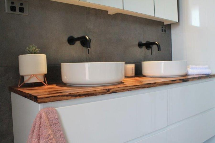 Modern double vanity with vessel basins, timber benchtop and matte black wall taps