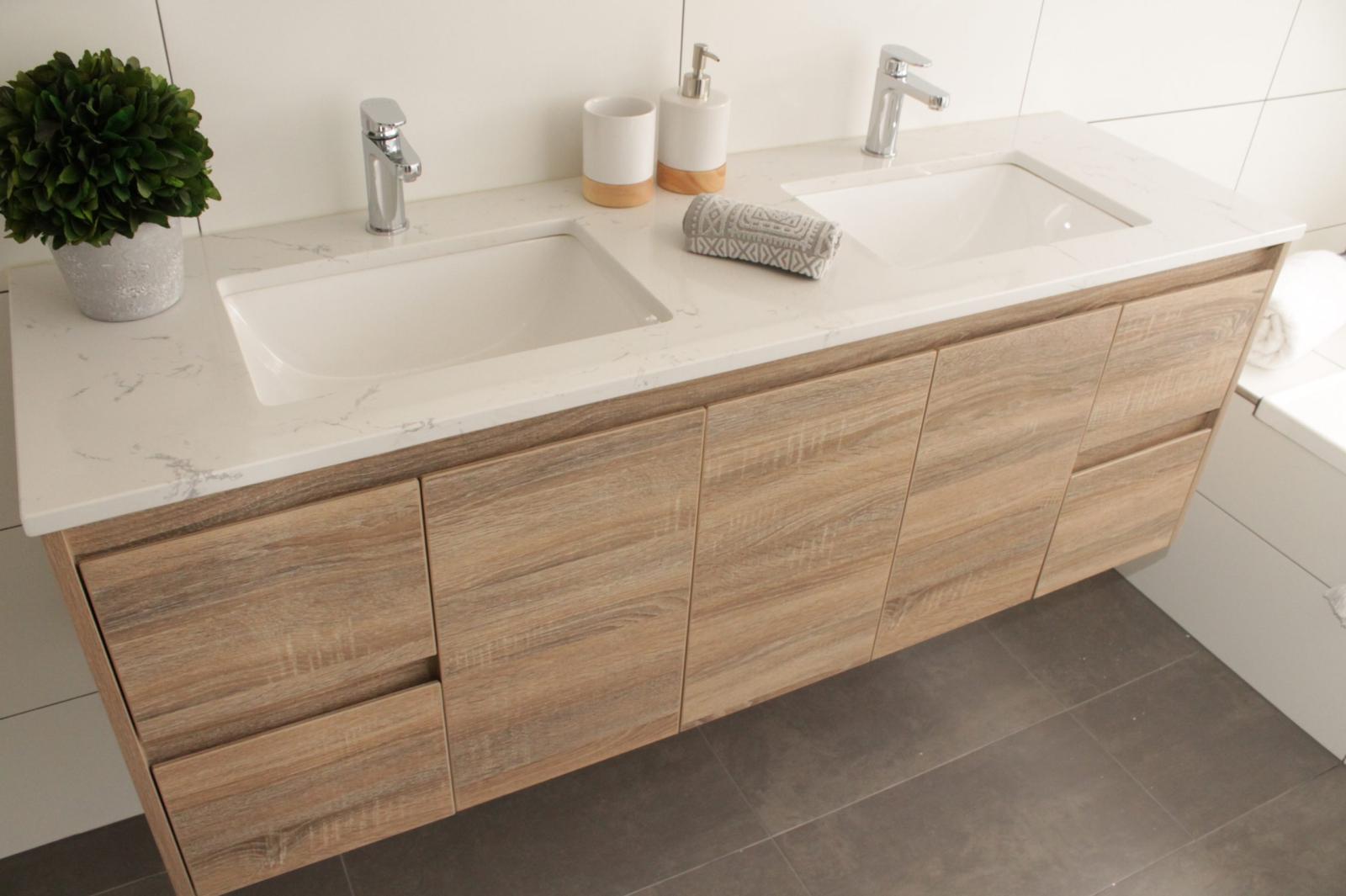 Timber double vanity with white stone top and integrated basins in a modern bathroom