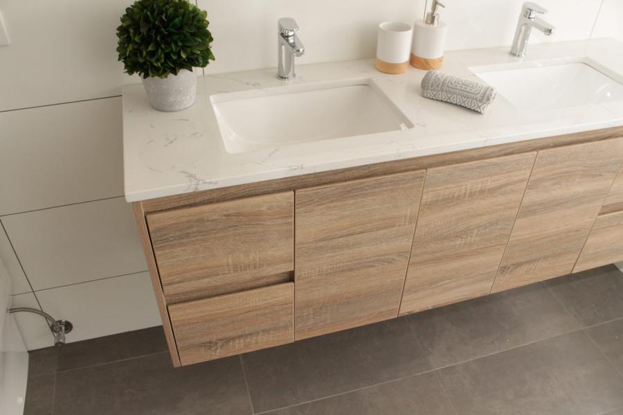 Floating timber bathroom vanity with double basin and white benchtop