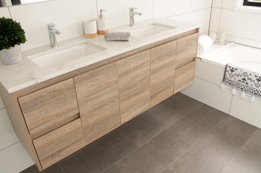 Double vanity with timber cabinetry in a modern white bathroom