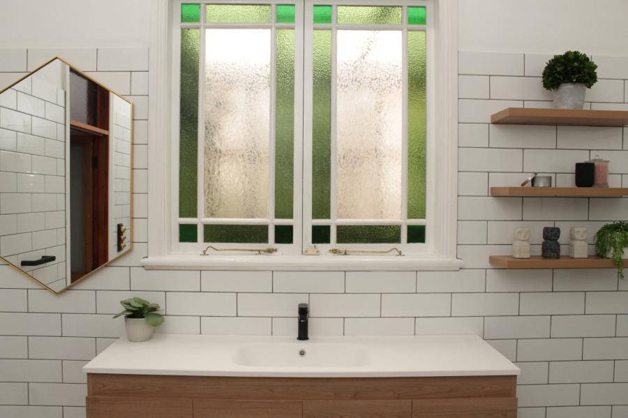 Modern bathroom vanity with frosted leadlight window and white subway tiles