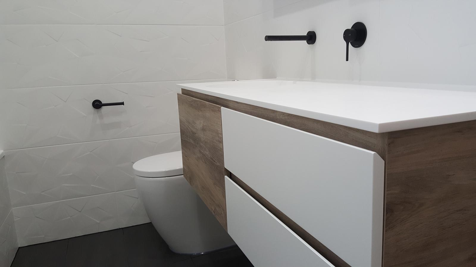 Modern bathroom with timber vanity and black tapware