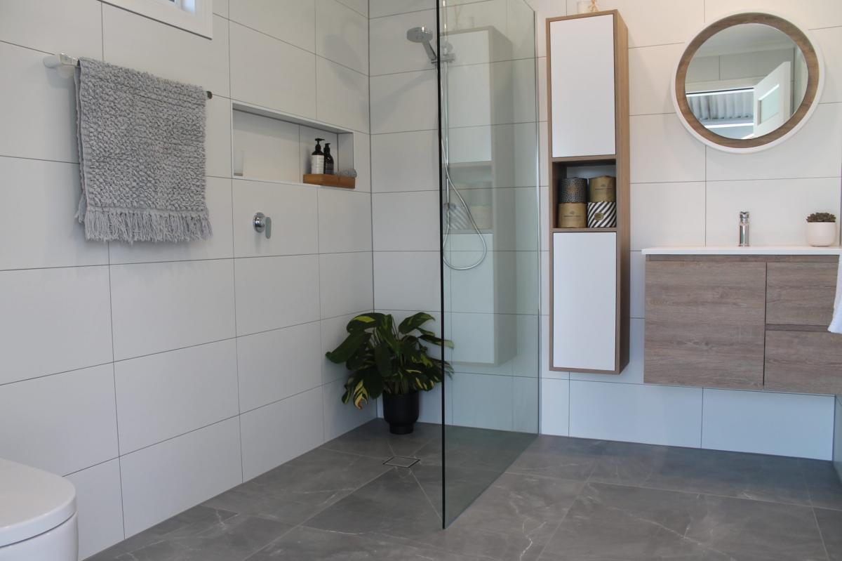 Modern bathroom with walk-in shower and timber vanity