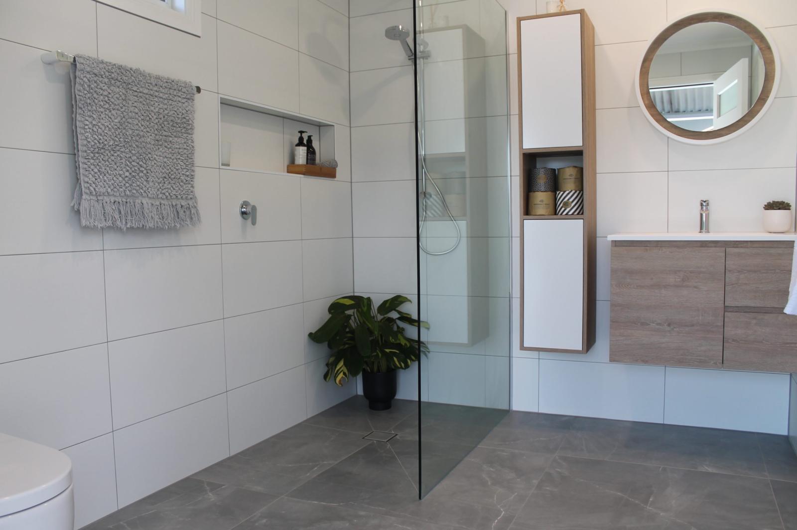 Modern bathroom with walk-in shower and timber vanity