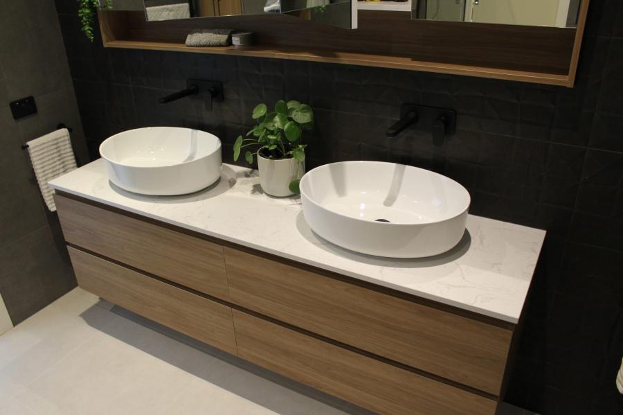 Timber double vanity with twin vessel basins in a modern bathroom