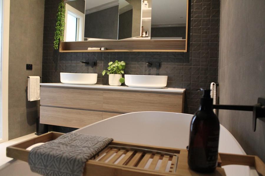 Modern bathroom with freestanding bath, double vanity and vessel basins