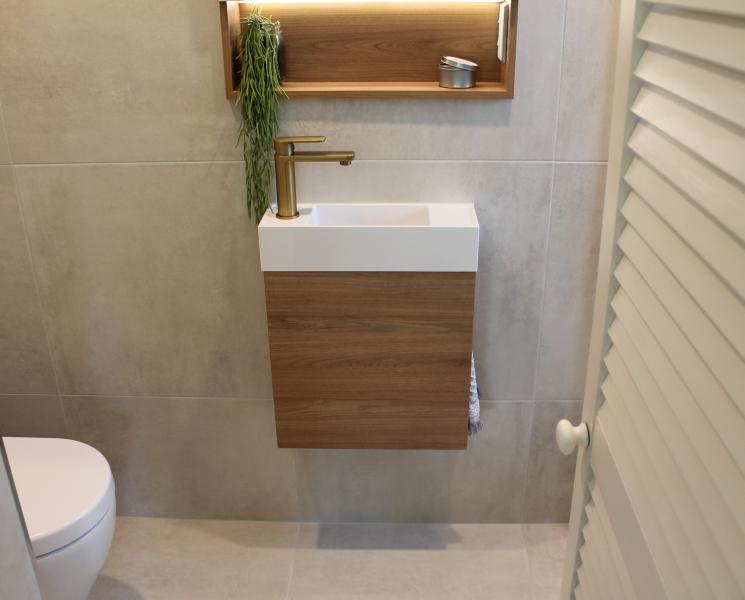 Compact modern bathroom vanity with square basin, timber cabinet and brass tapware