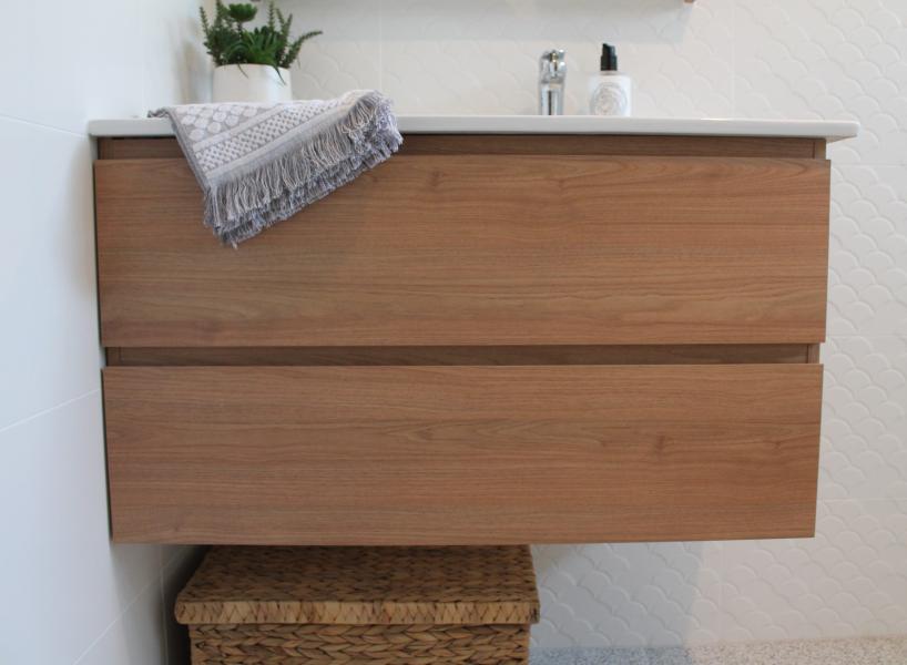 Floating timber bathroom vanity with stone benchtop and two drawers