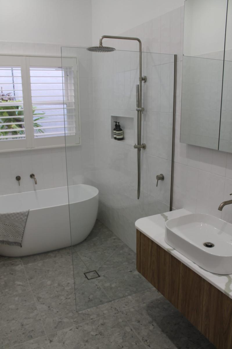 Modern ensuite with freestanding bath and walk-in shower