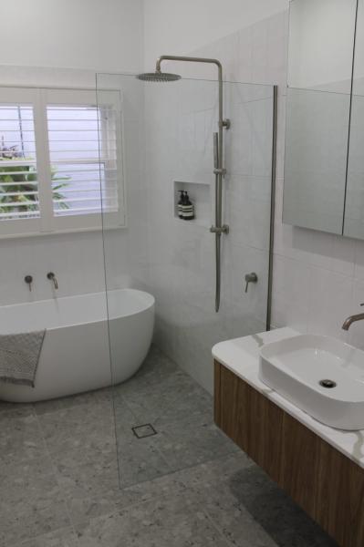 Modern ensuite with freestanding bath and walk-in shower
