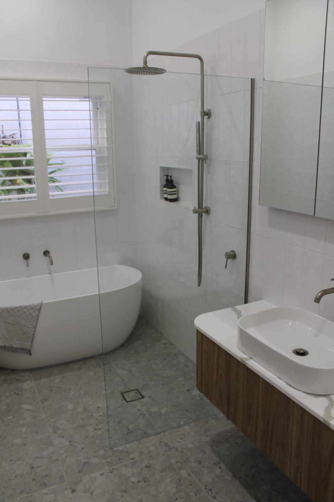 Modern ensuite with freestanding bath and walk-in shower