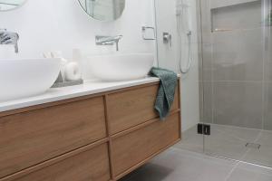 Modern bathroom with timber vanity and walk-in shower