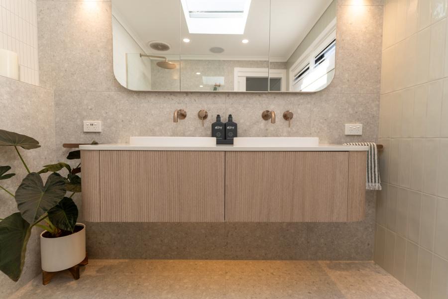 Modern bathroom with double vanity and timber cabinetry
