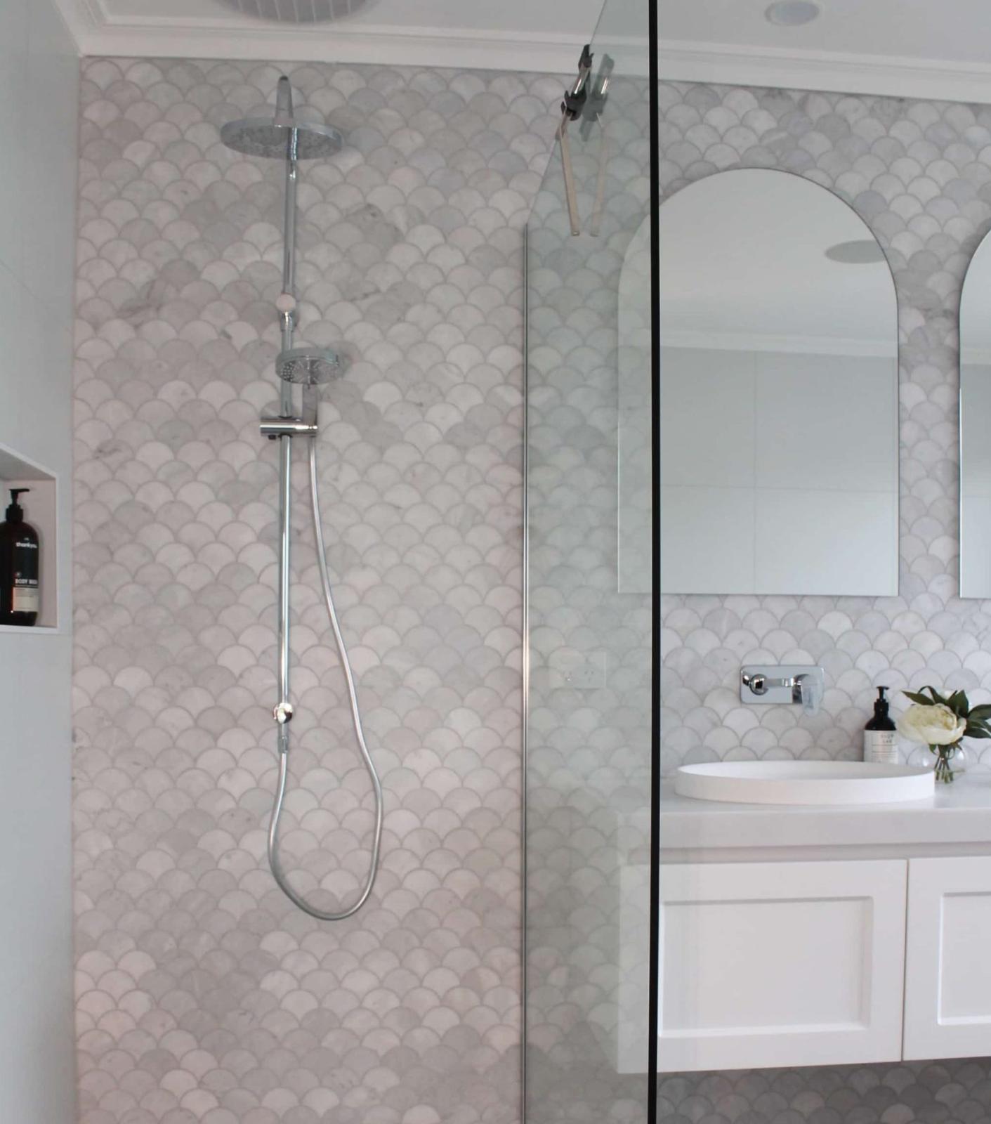 Modern bathroom with mosaic tile shower and vanity