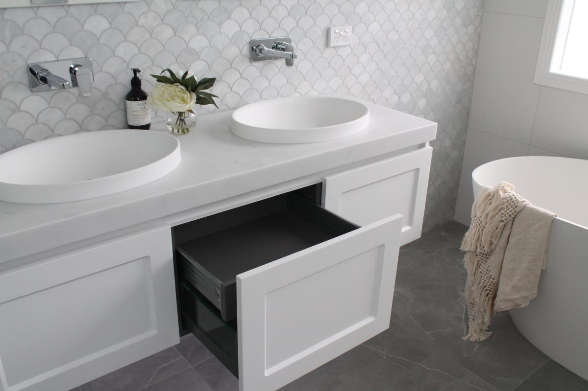 Modern bathroom with double vanity and round basins