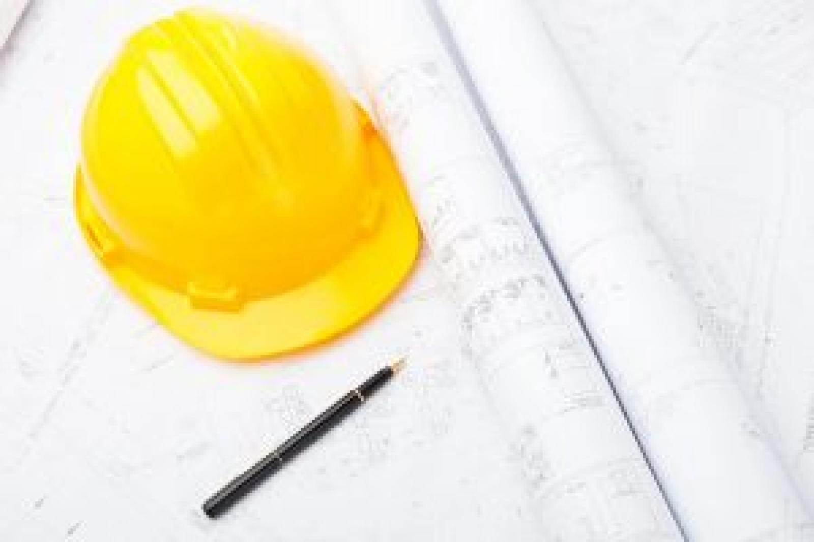 blue-print-and-safety-helmet-KZ7B3UP-scaled-p7337ckn10i0suneytcjx9tjm8p67pyowgrtr98mvk.jpg