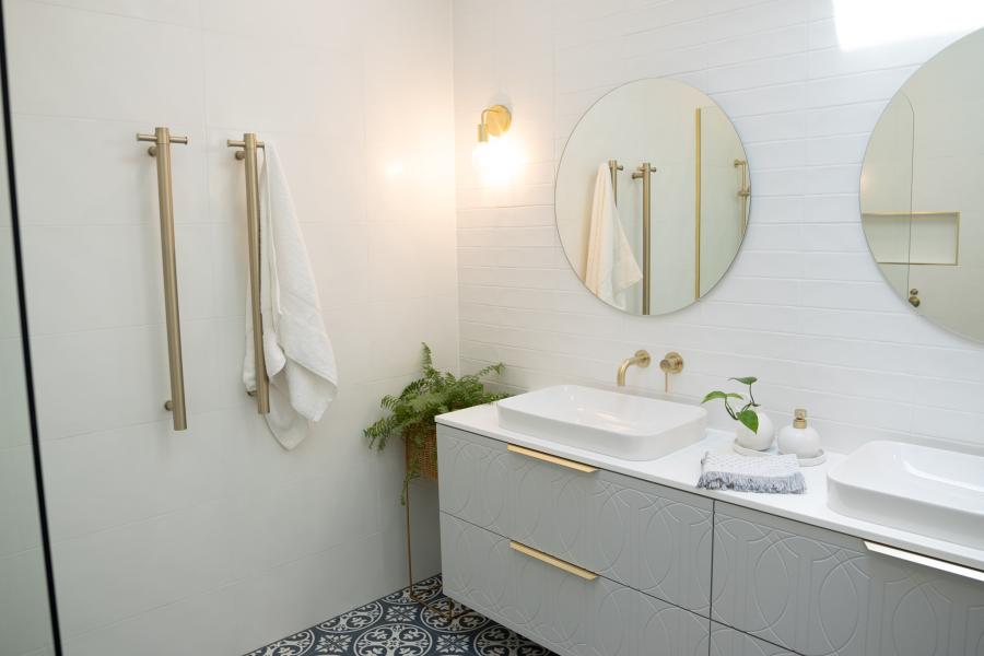 Bathroom renovation under construction with framing and plumbing